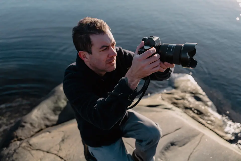 A person is taking photographs with the Leica SL3-S