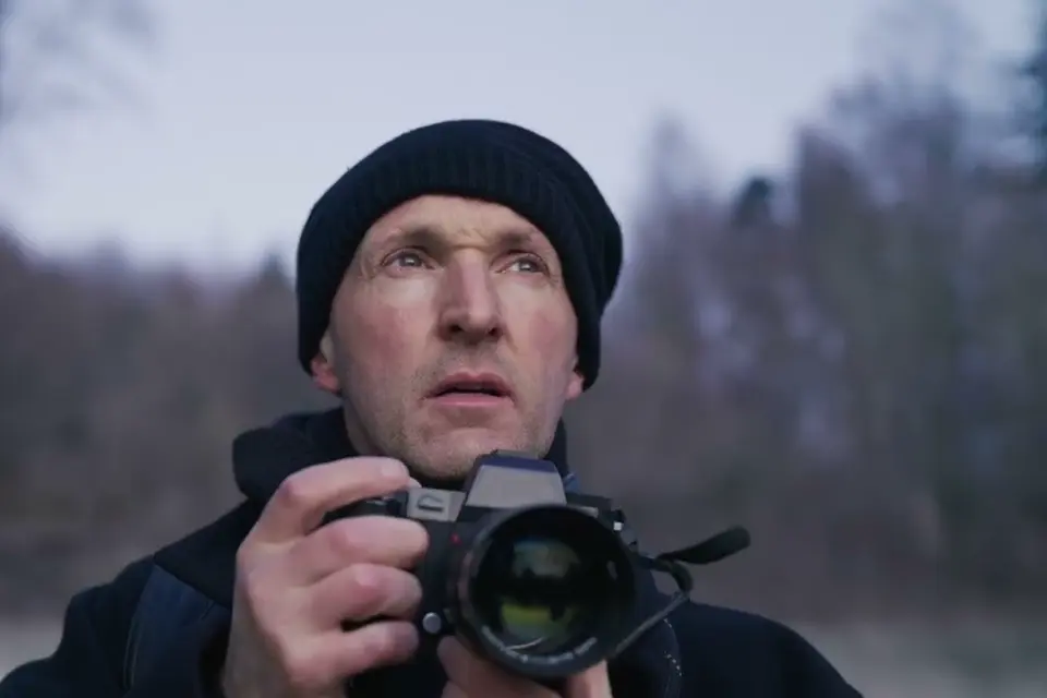 Phil Penman is composing a photograph in Biel