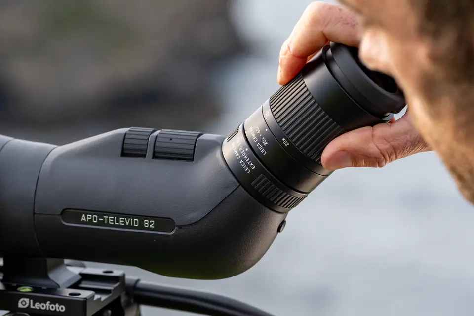 Man is putting the eyepiece 20x-60x on his Televid spotting scope