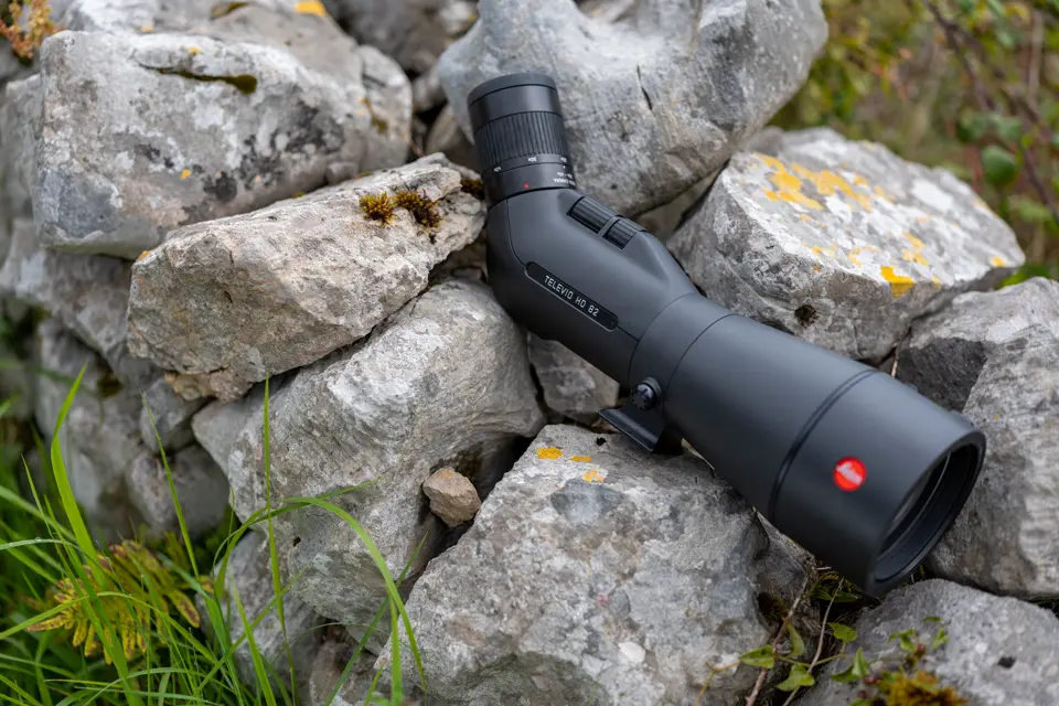 Leica Spotting scope is lying on a rock