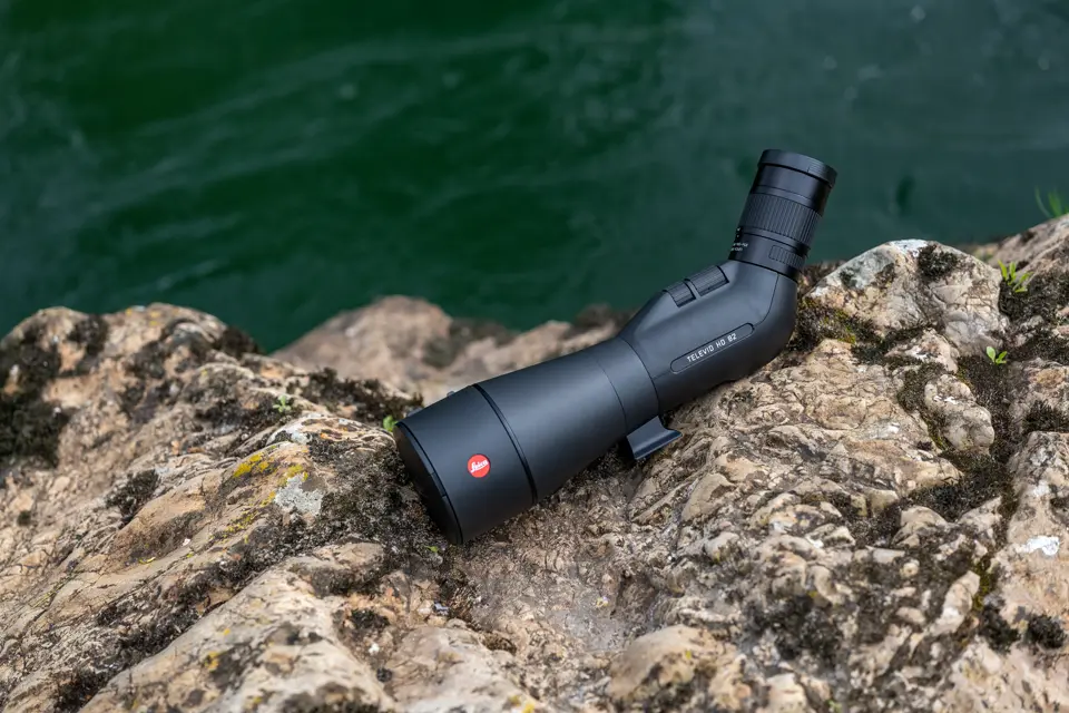 Leica Spotting Scope is lying on a rock