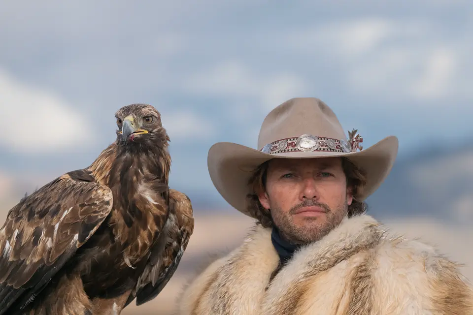 Photographer Diego Rodriguez with a falcon on his arm