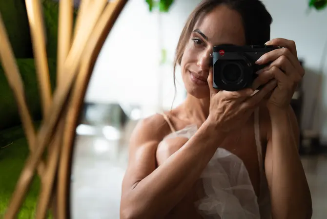 Kylie Shea with a leica camera