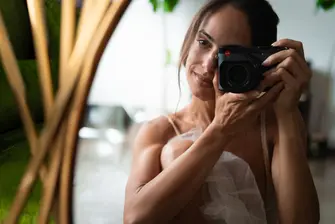Kylie Shea with a leica camera