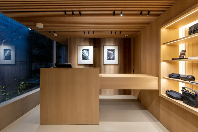 Shelf with camera bags inside Leica Store Tokyo Omotesando.