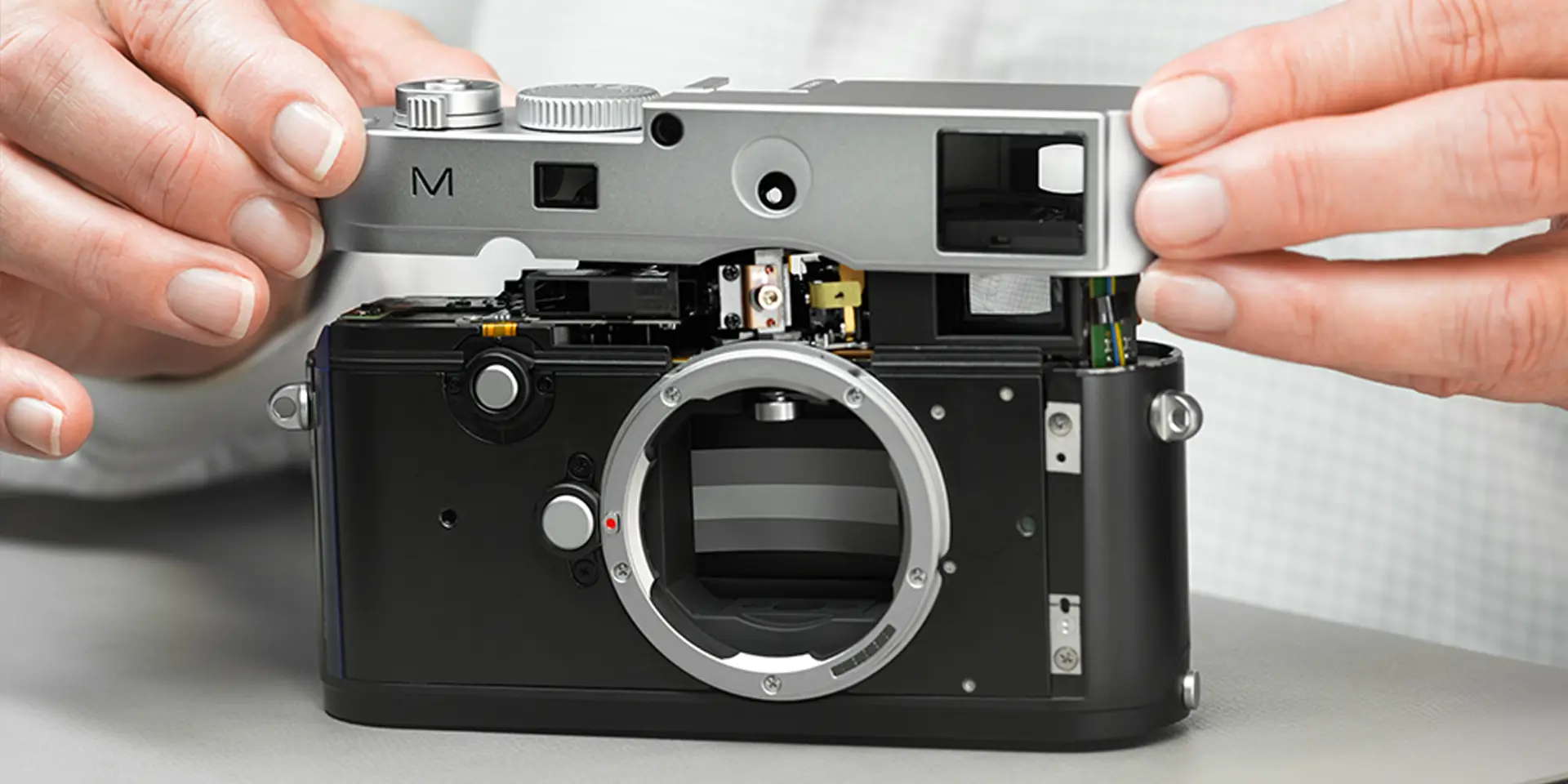 Man repairs a Leica M Camera