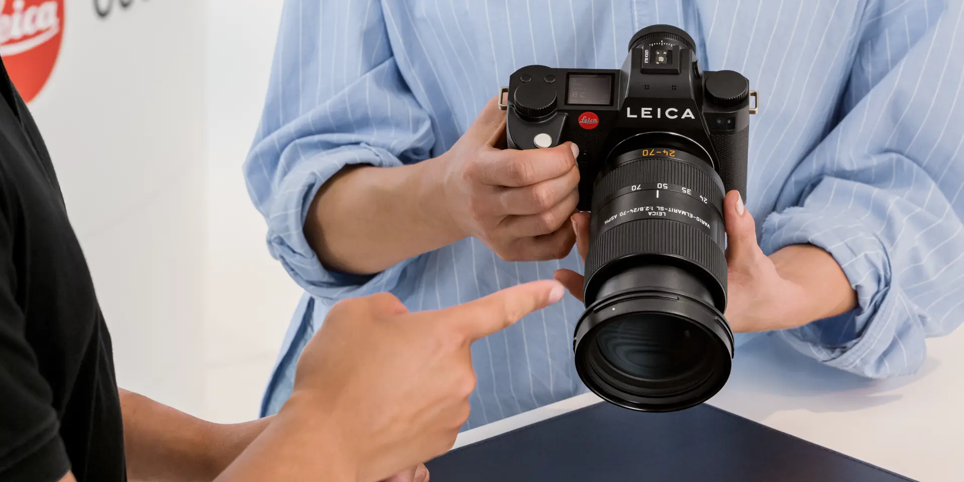 A woman with a SL3 in her hands