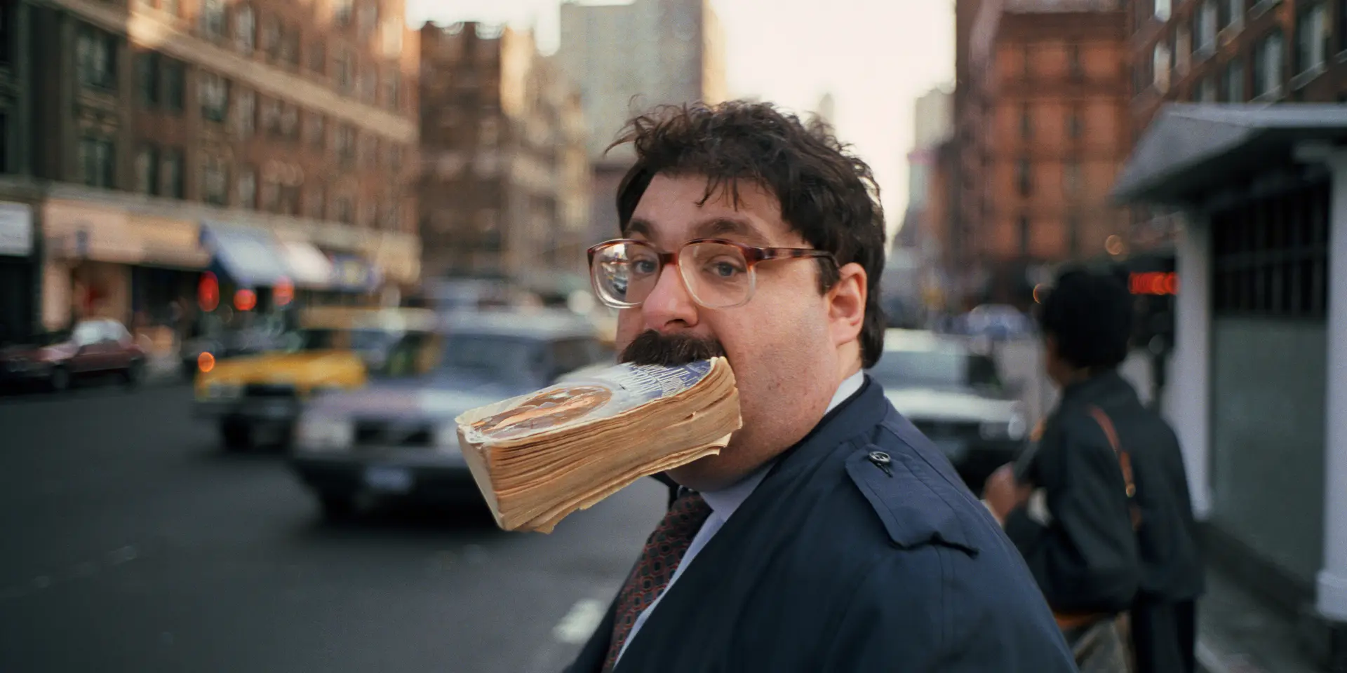 Man with a book in his mouth