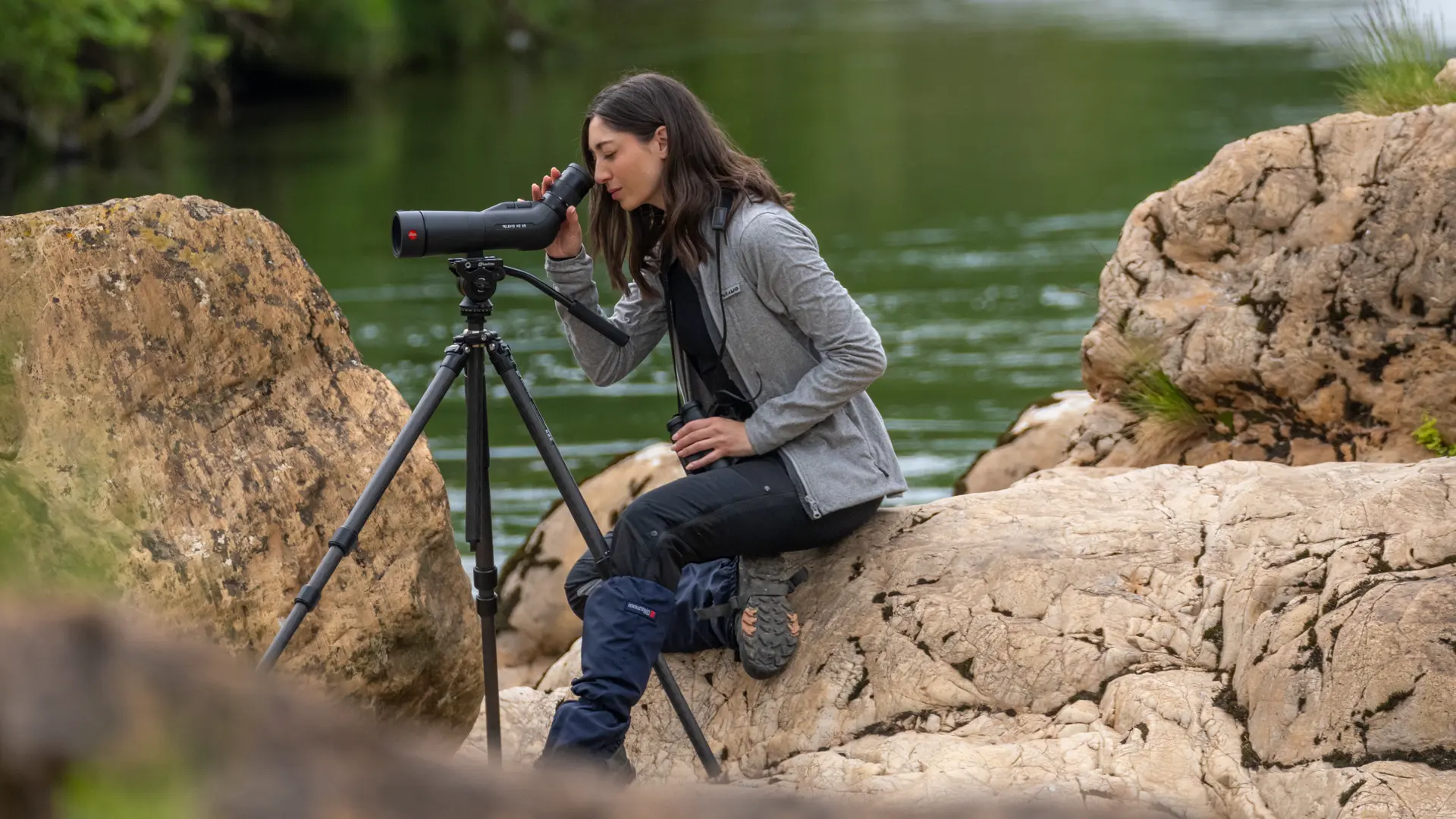 Woman-is-looking-through-her-Leica-Spotting-Scope