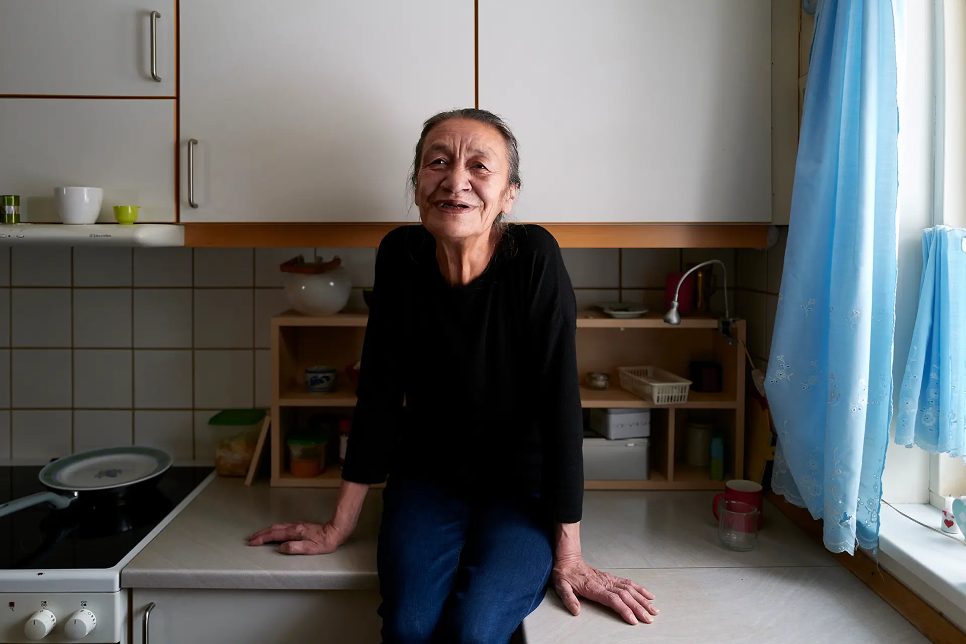 old woman in a kitchen