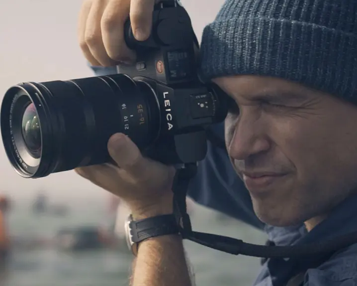 Close-up of a man taking a picture.