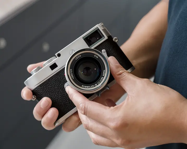Man operating a Leica Camera