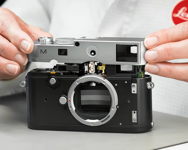Man repairs a Leica M Camera