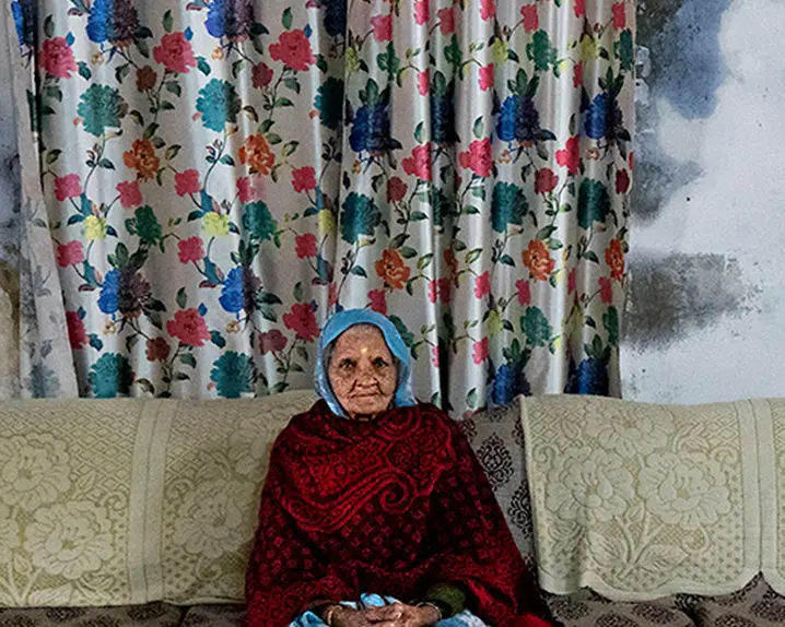 old woman sitting on a sofa