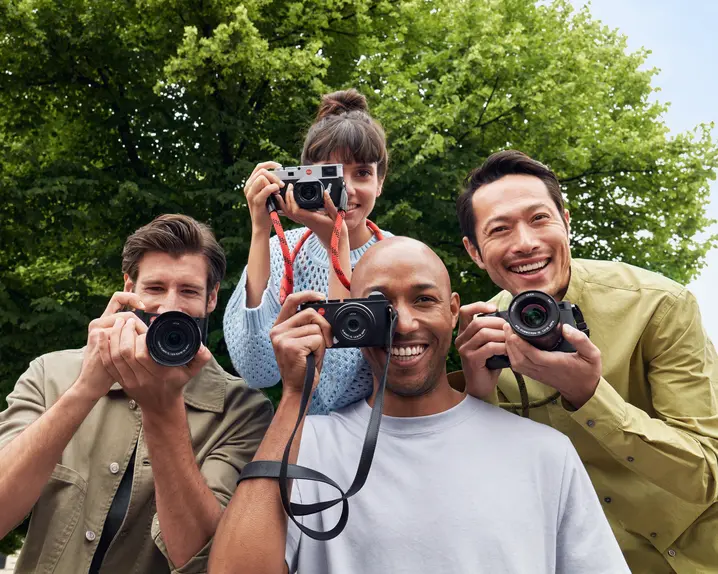 Group of people with leica cameras