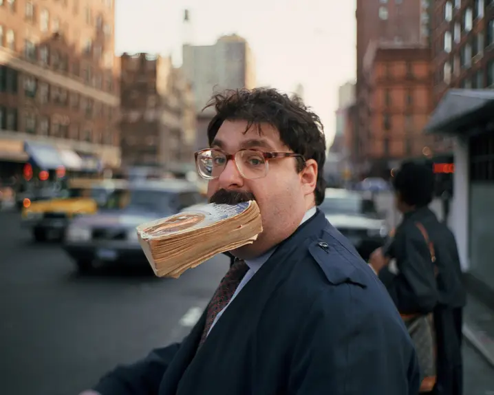 Man with a book in his mouth