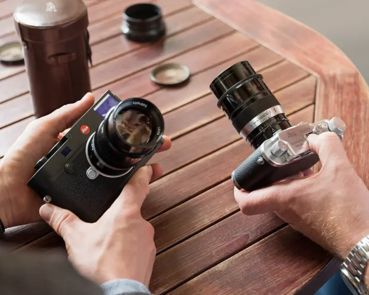 Two people are holding Leica M-Cameras