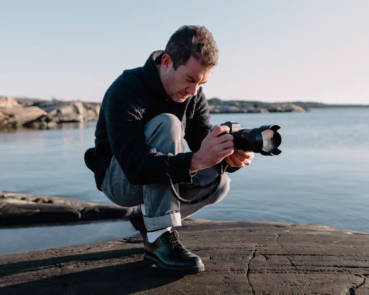 A person is taking photographs with the Leica SL3-S.