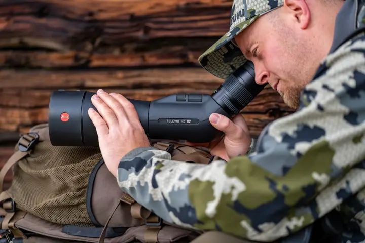 Man is looking through his Televid HD spotting scope