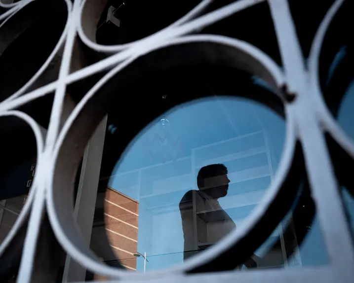 Reflection of a man in a building