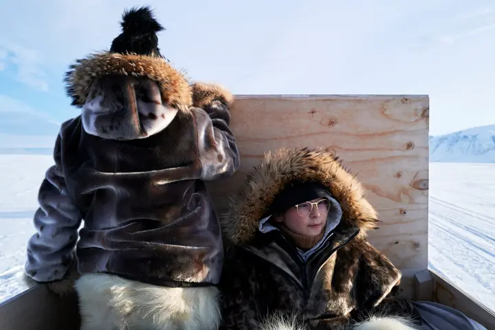 Father and son on a vehicle in the Antarctic