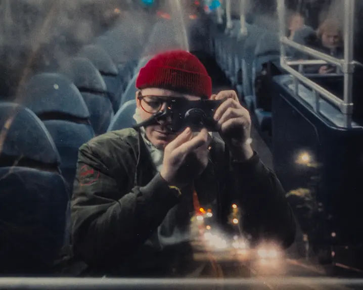 Man in a Bus with leica camera