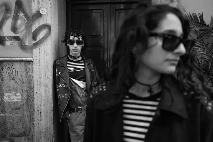 Black and white street photograph of a man and a woman