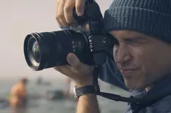 Close-up of a man taking a picture.