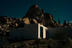 Architectural building in the rocks in the evening sun.
