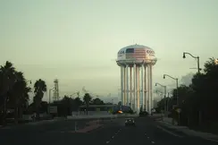 An empty road leads to a water tower labelled ‘Cocoa, Florida’.