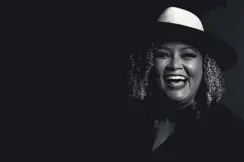 Portrait of a smiling woman wearing a hat