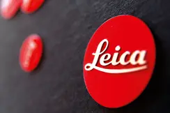 Close-up of the red Leica logo on a black background