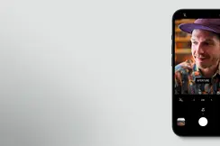 An iPhone displaying a preview of the Leica Lux app on its screen
