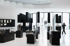 Exhibition hall with displays of historic cameras and photographs.