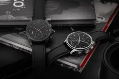 Two Leica Monochrom watches on a pile of books.
