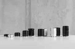 TL-Lenses in a variety of sizes are lined up next to each other.