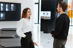Two Leica employees