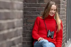 Woman with Trinovid HD around her neck