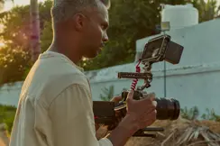 Photographer with Leica SL3-S.
