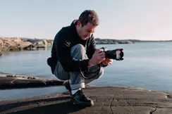 A person is taking photographs with the Leica SL3-S.