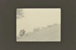 couple sitting hugging on large stones