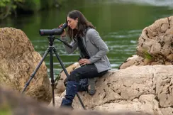 Woman-is-looking-through-her-Leica-Spotting-Scope