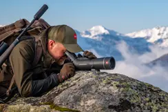 Man-is-looking-through-his-Leica-Televid-HD-spotting-scope