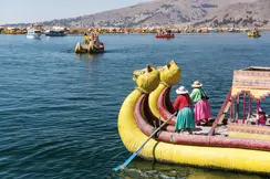 2 women on a yellow dragon boat in Latin America
