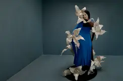 Woman in a blue dress with big flowers
