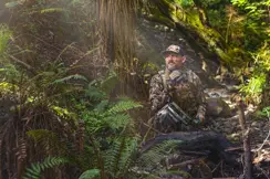 Hunter sitting in a forrest