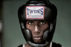 Portrait of a black boxer wearing a boxing helmet