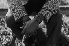 Brandon Ruffin sitting on a bank with his Leica ZM2