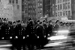 soldiers walking on street b&w