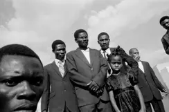 a group of people of colour b&w